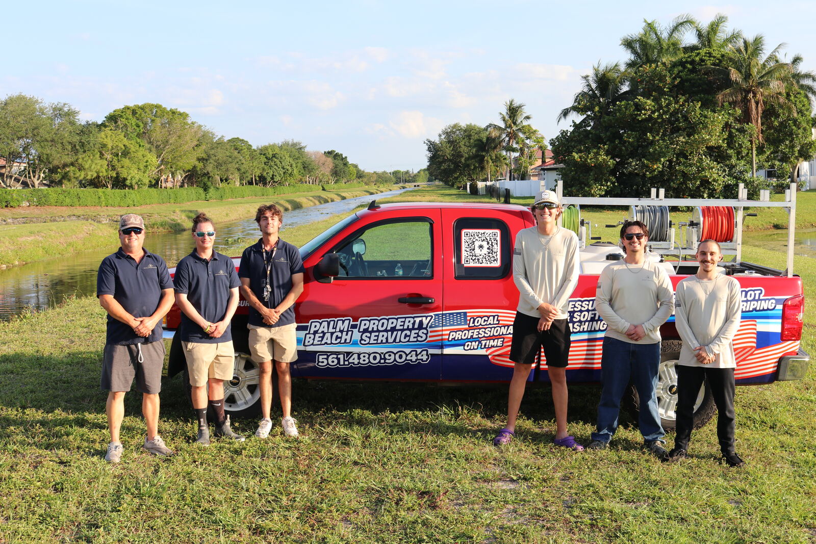Palm Beach Property Services crew with branded service truck — South Florida